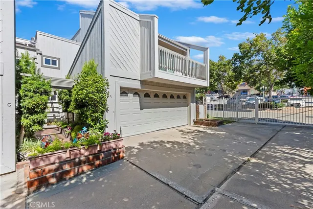 a view of a hallway with stairs and furniture