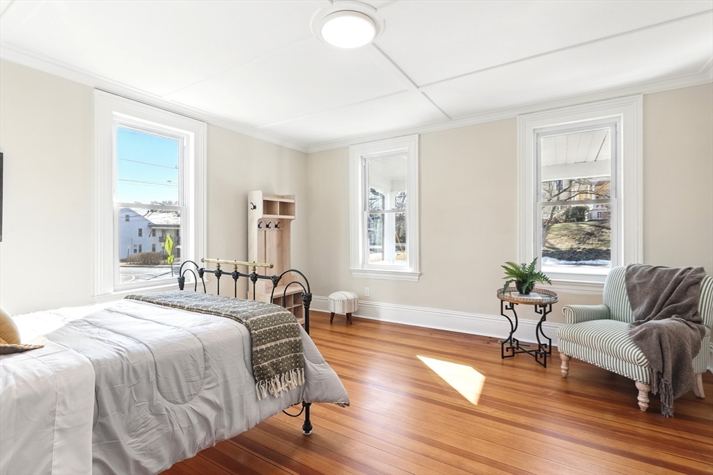 180 State Street, Unit A Northampton, MA 01060 - Photo 23 of 40 a spacious bedroom with a bed and wooden floor