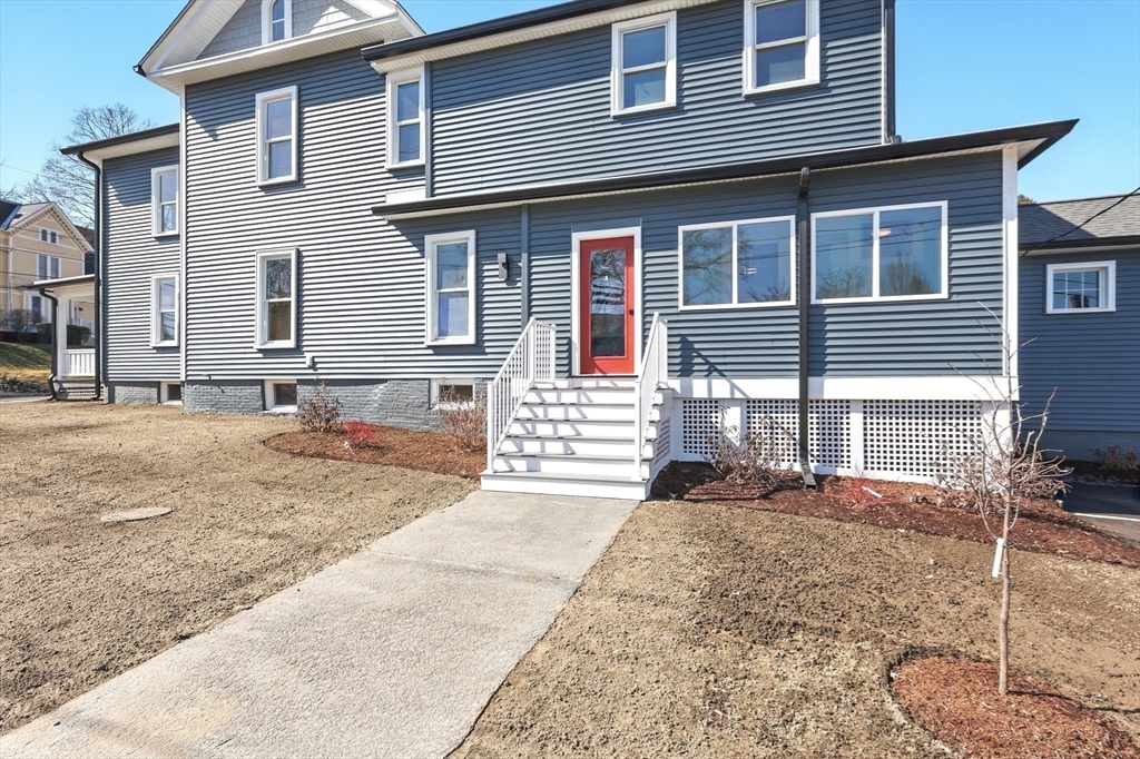 180 State Street, Unit A Northampton, MA 01060 - Photo 32 of 40 a front view of a house with a yard
