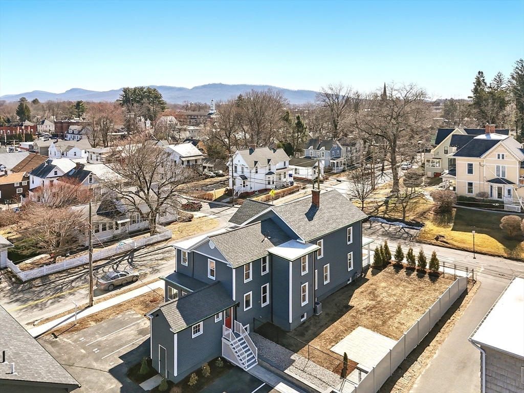 180 State Street, Unit A Northampton, MA 01060 - Photo 36 of 40 a view of a city from a balcony with furniture