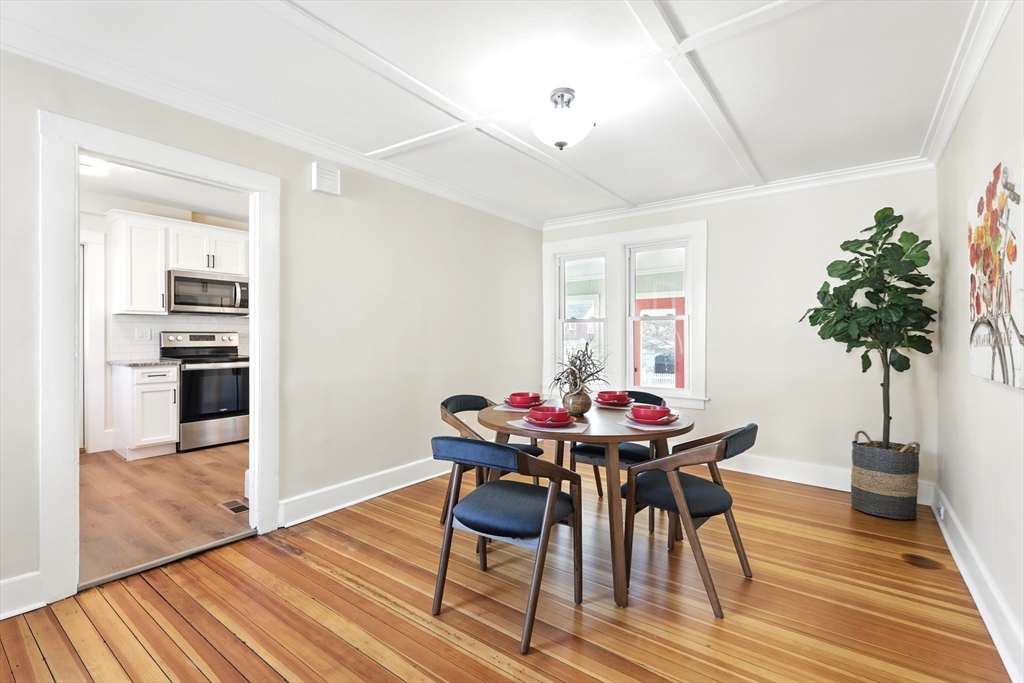 180 State Street, Unit A Northampton, MA 01060 - Photo 9 of 40 a view of a dining room with furniture and wooden floor