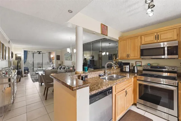 a kitchen with counter top space appliances and cabinets
