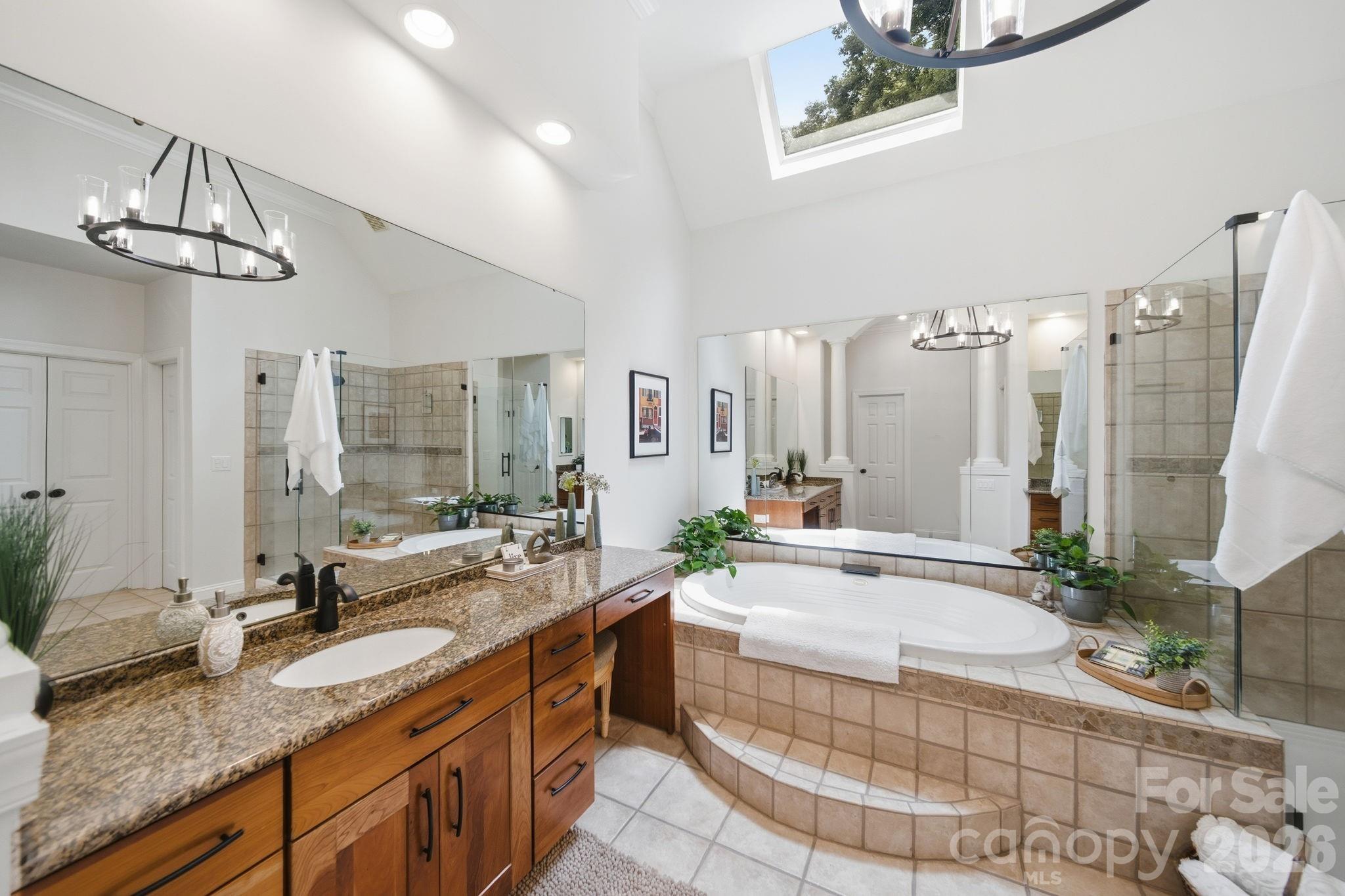 1802 Summit View Place Waxhaw, NC 28173 - Photo 21 of 47 a spacious bathroom with sinks mirror and a bathtub