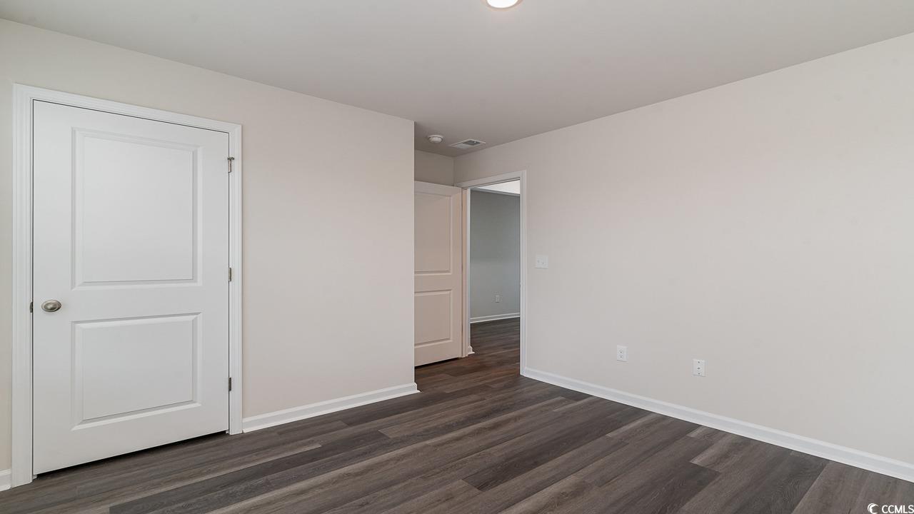 6050 Fuller Rdg Court Conway, SC 29526 - Photo 16 of 22 Spare room featuring dark wood-type flooring
