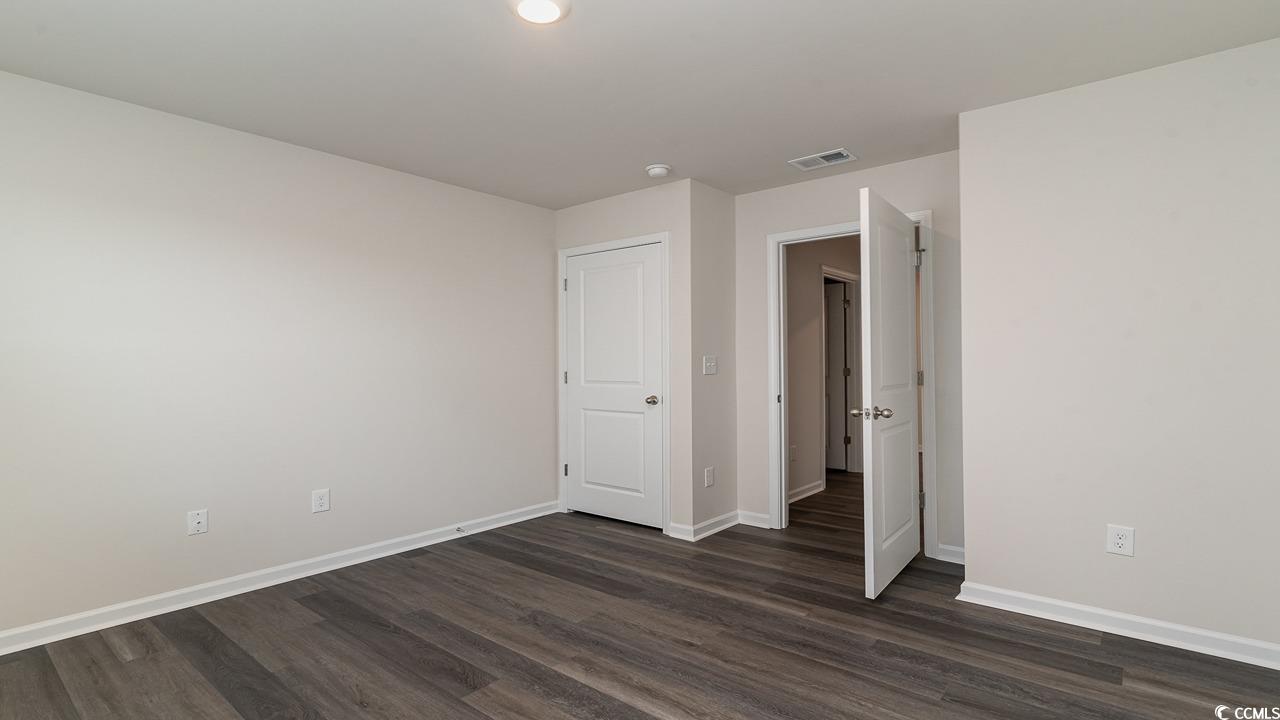 6050 Fuller Rdg Court Conway, SC 29526 - Photo 20 of 22 Spare room featuring dark wood-type flooring