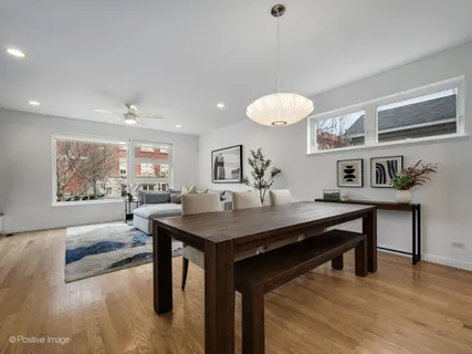 a view of a room with furniture and wooden floor