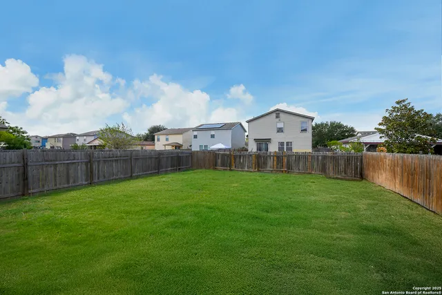 a view of a yard in front of a house
