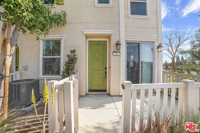 a view of a house with a small yard