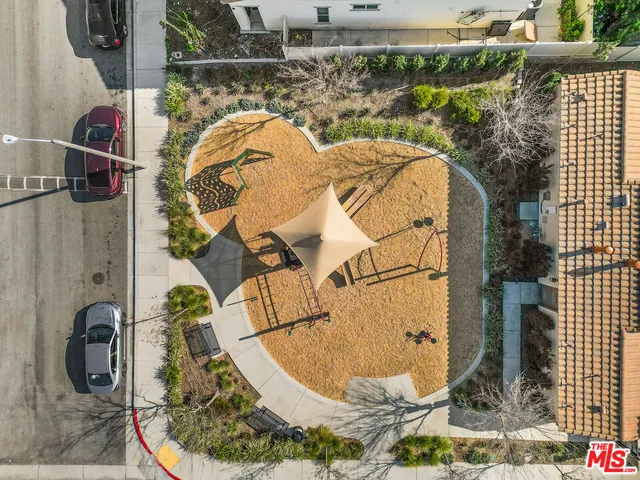 an aerial view of a house with a yard