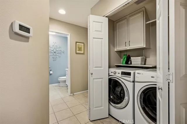 a view of a hallway with washer and dryer