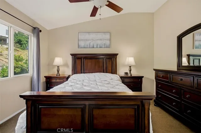 a bed room with a bed and a mirror