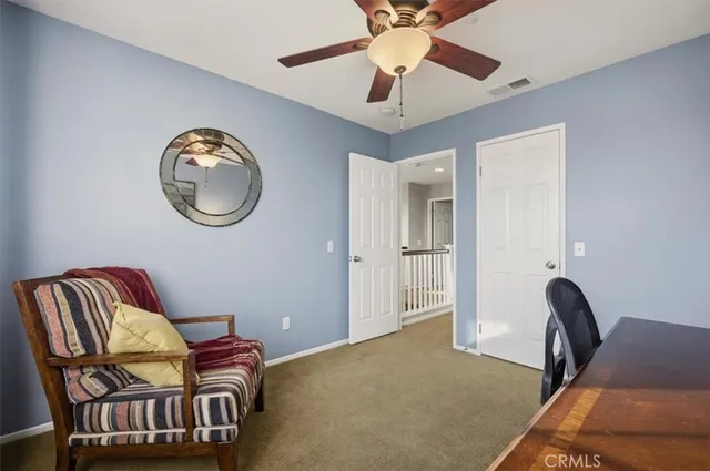 a bedroom with a bed and a view of bedroom