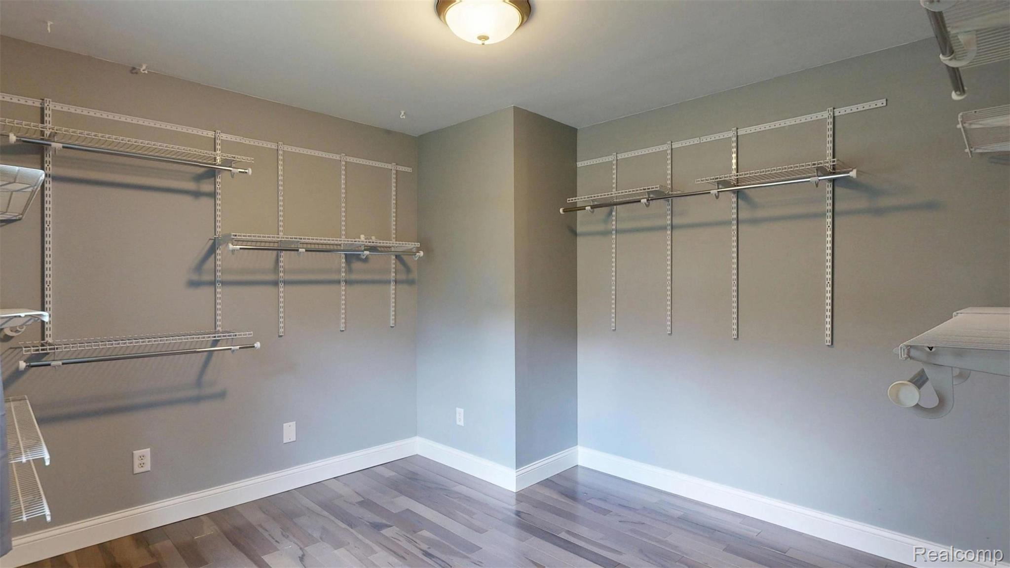 10300 Clark Road Davisburg, MI 48350 - Photo 19 of 39 Walk in closet with light wood-type flooring