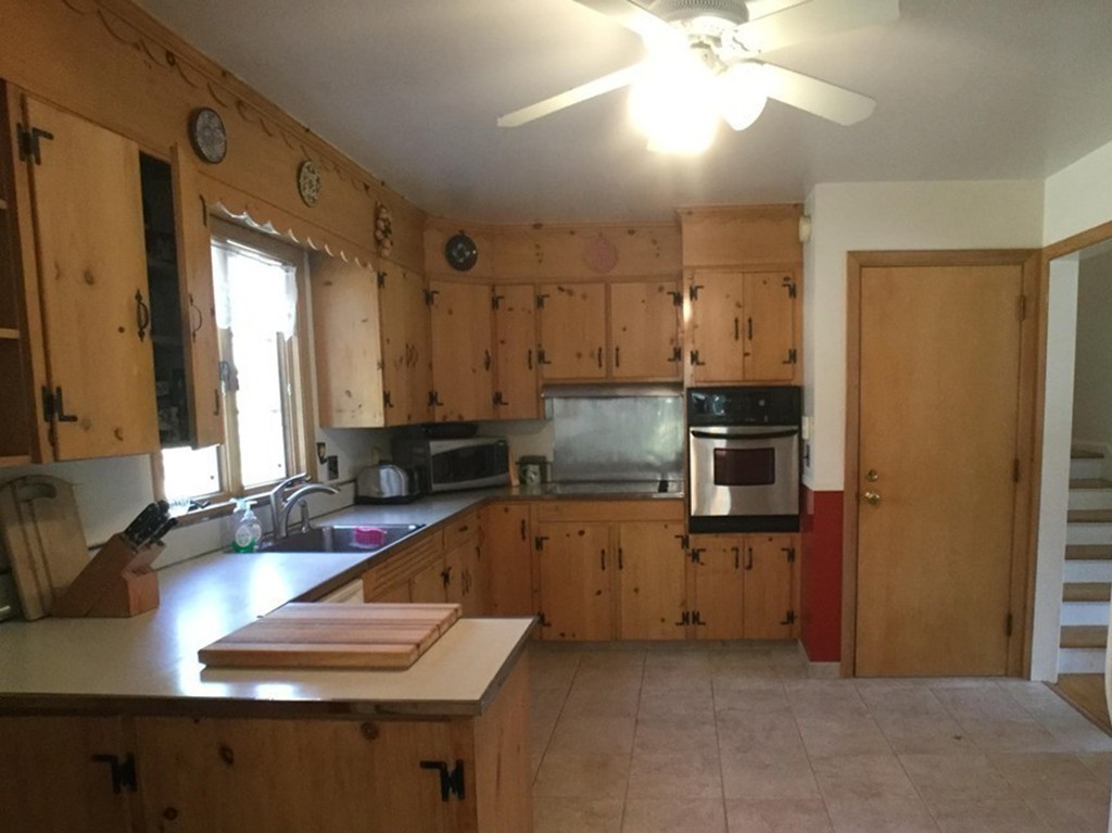 27 Fox Farms Road Northampton, MA 01062 - Photo 6 of 14 a kitchen with kitchen island granite countertop a sink appliances counter top space and cabinets