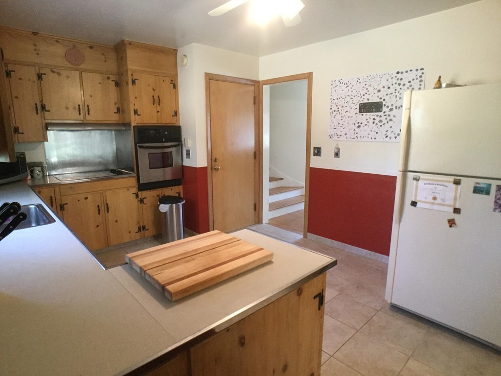 27 Fox Farms Road Northampton, MA 01062 - Photo 7 of 14 a kitchen with a refrigerator and a stove