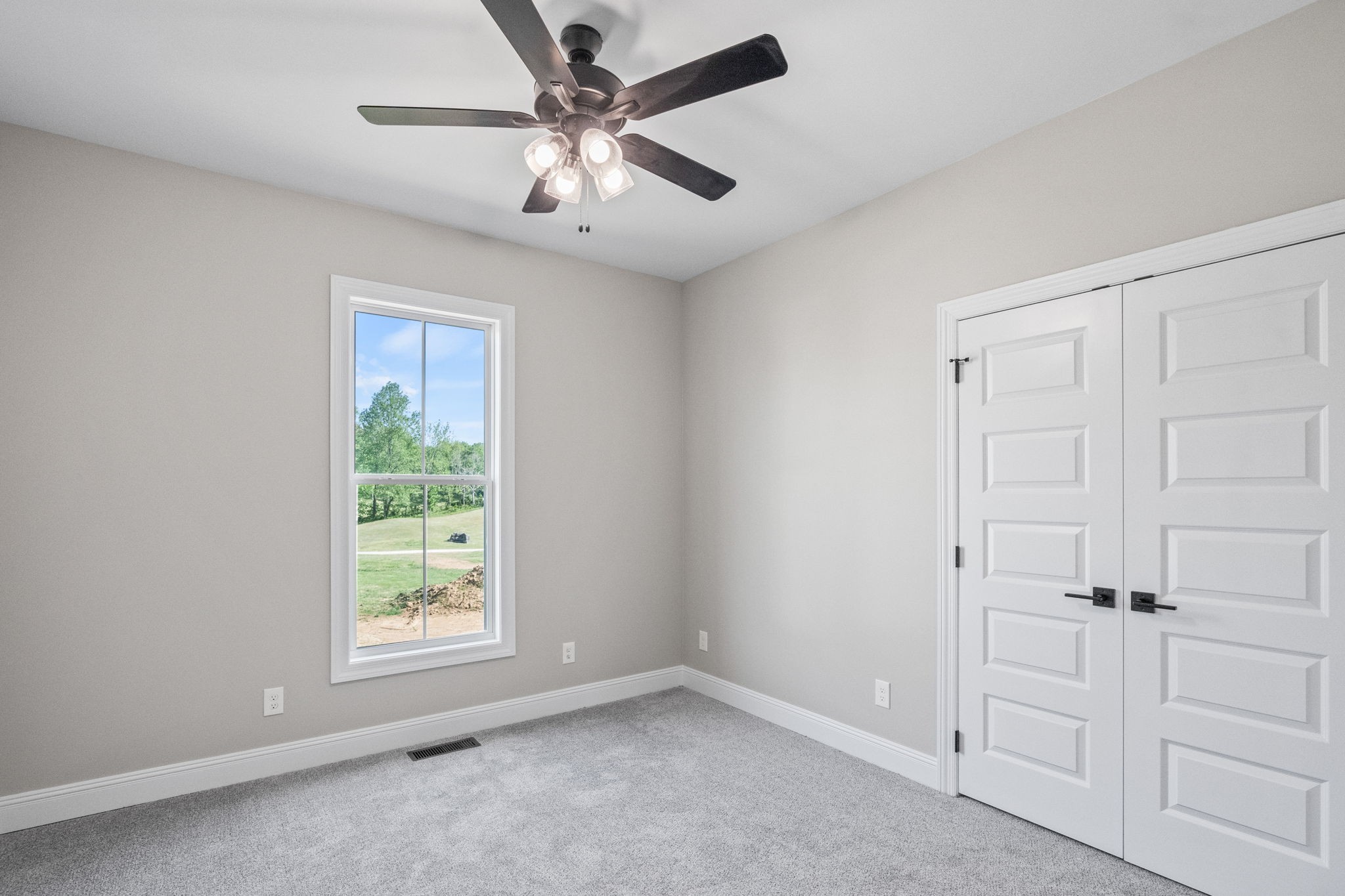 136 Augusta Trail Springfield, TN 37172 - Photo 11 of 31 an empty room with windows and fan