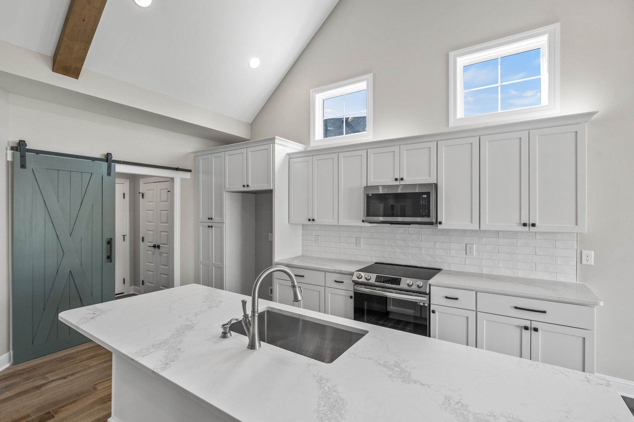 136 Augusta Trail Springfield, TN 37172 - Photo 21 of 31 a kitchen with stainless steel appliances granite countertop a sink stove and refrigerator