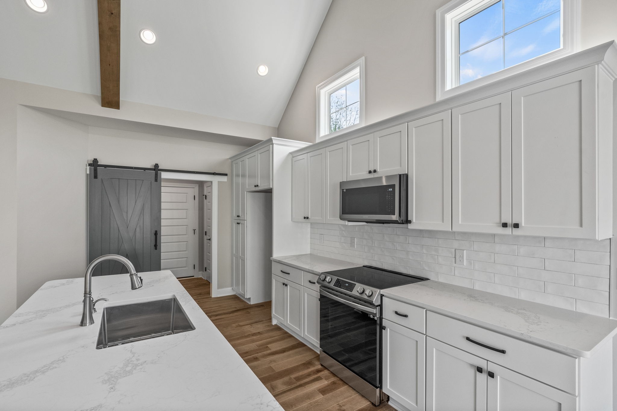 136 Augusta Trail Springfield, TN 37172 - Photo 23 of 31 a kitchen with granite countertop a stove and white cabinets