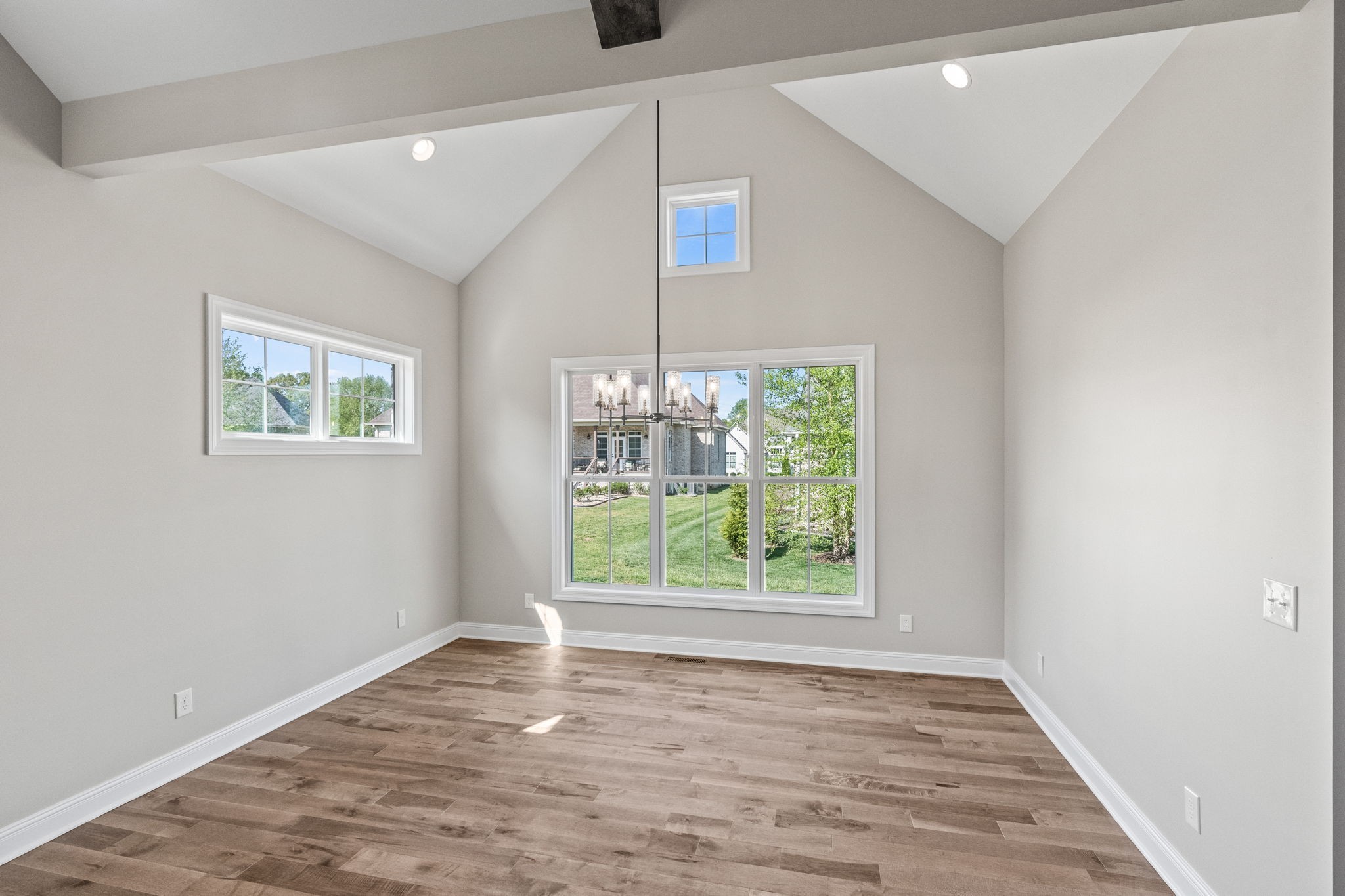 136 Augusta Trail Springfield, TN 37172 - Photo 26 of 31 an empty room with wooden floor and windows