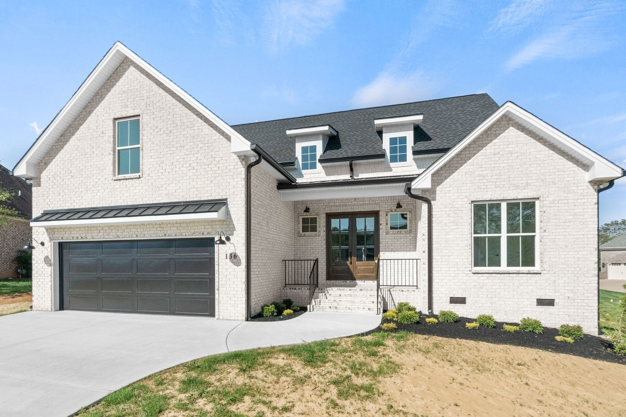 136 Augusta Trail Springfield, TN 37172 - Photo 4 of 31 a front view of a house with a yard and garage