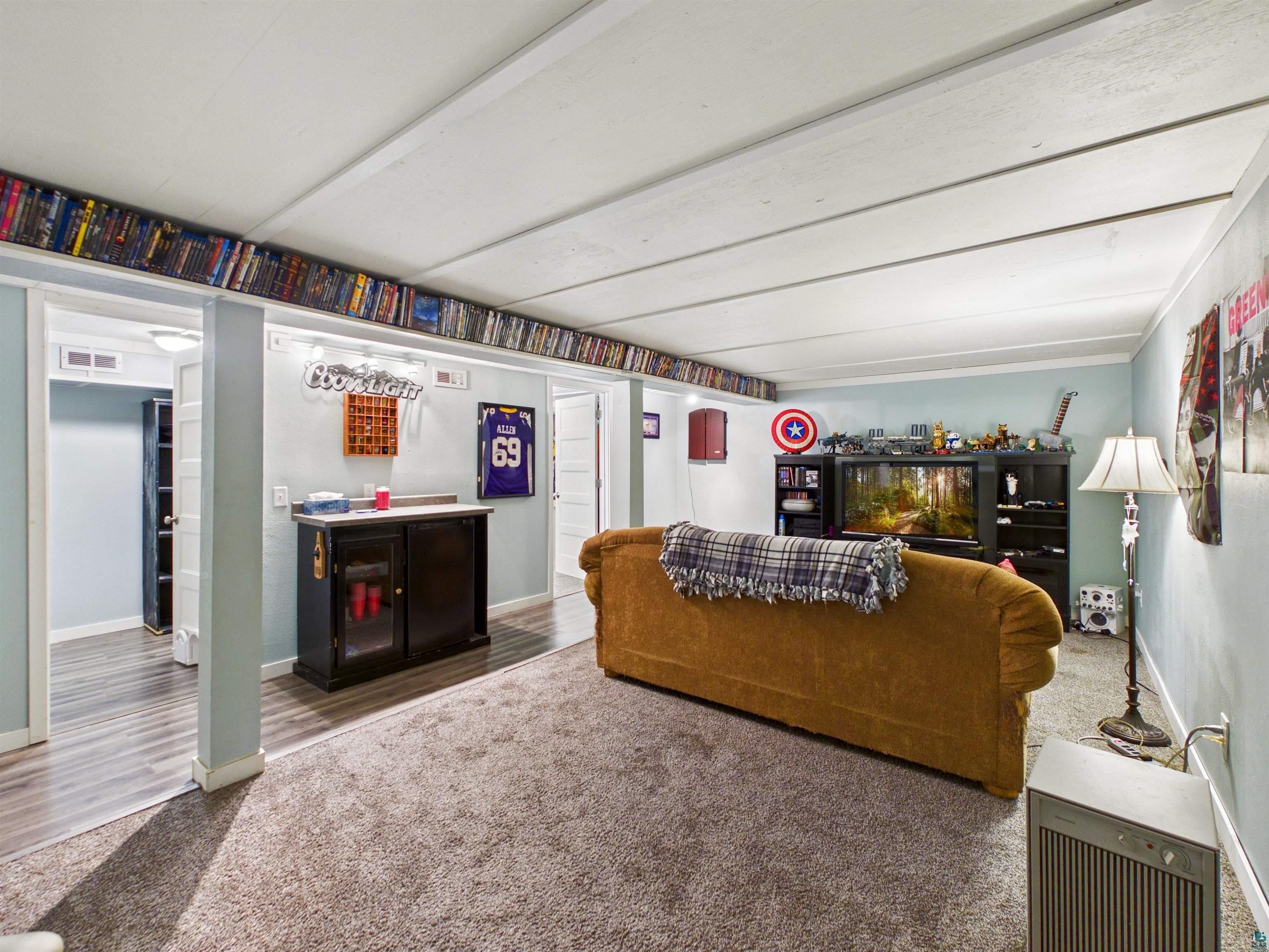 10719 North Oak Ridge Street Hayward, WI 54843 - Photo 38 of 57 Living room with carpet and baseboards