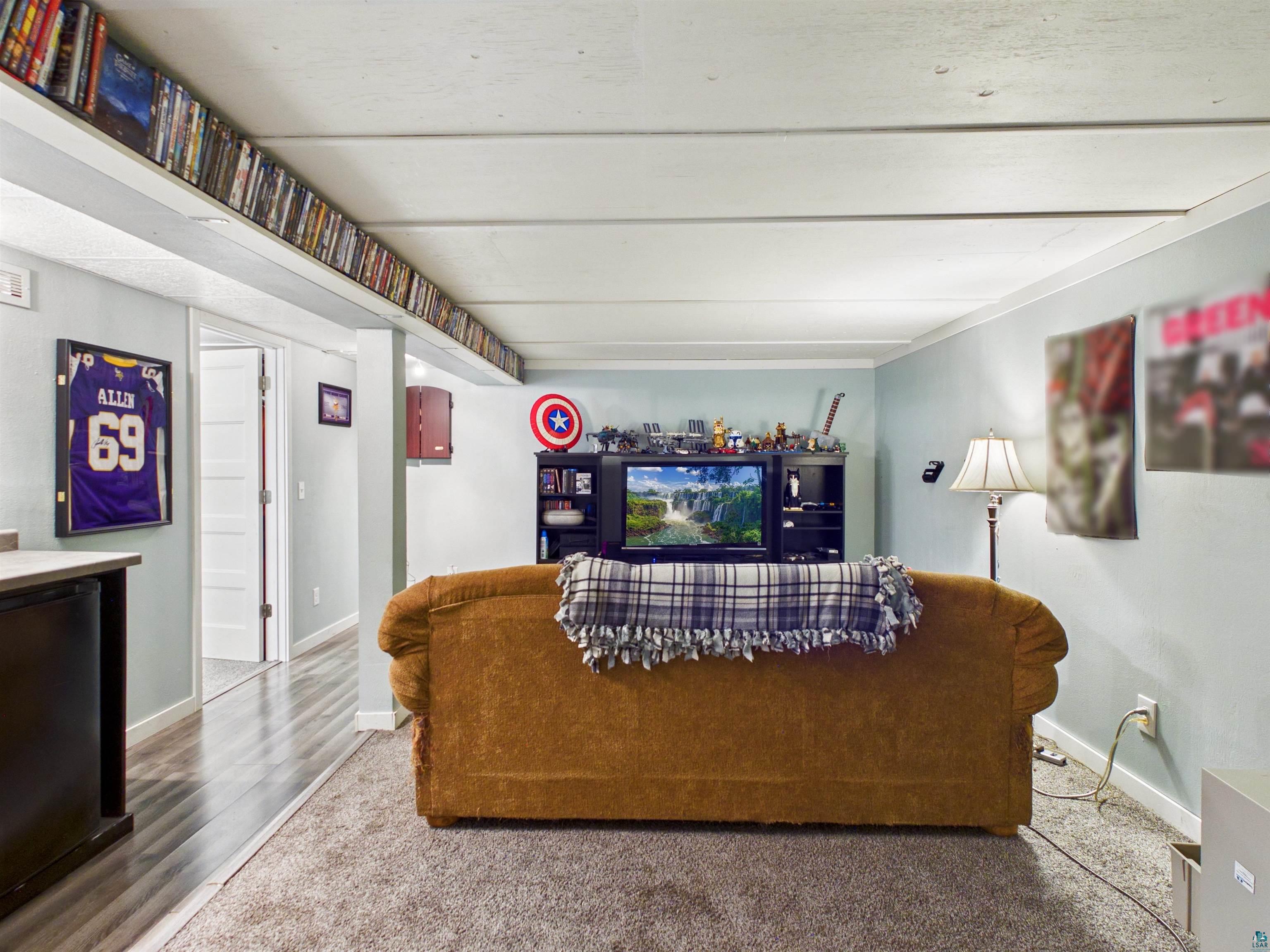 10719 North Oak Ridge Street Hayward, WI 54843 - Photo 40 of 57 Living room featuring baseboards and wood finished floors