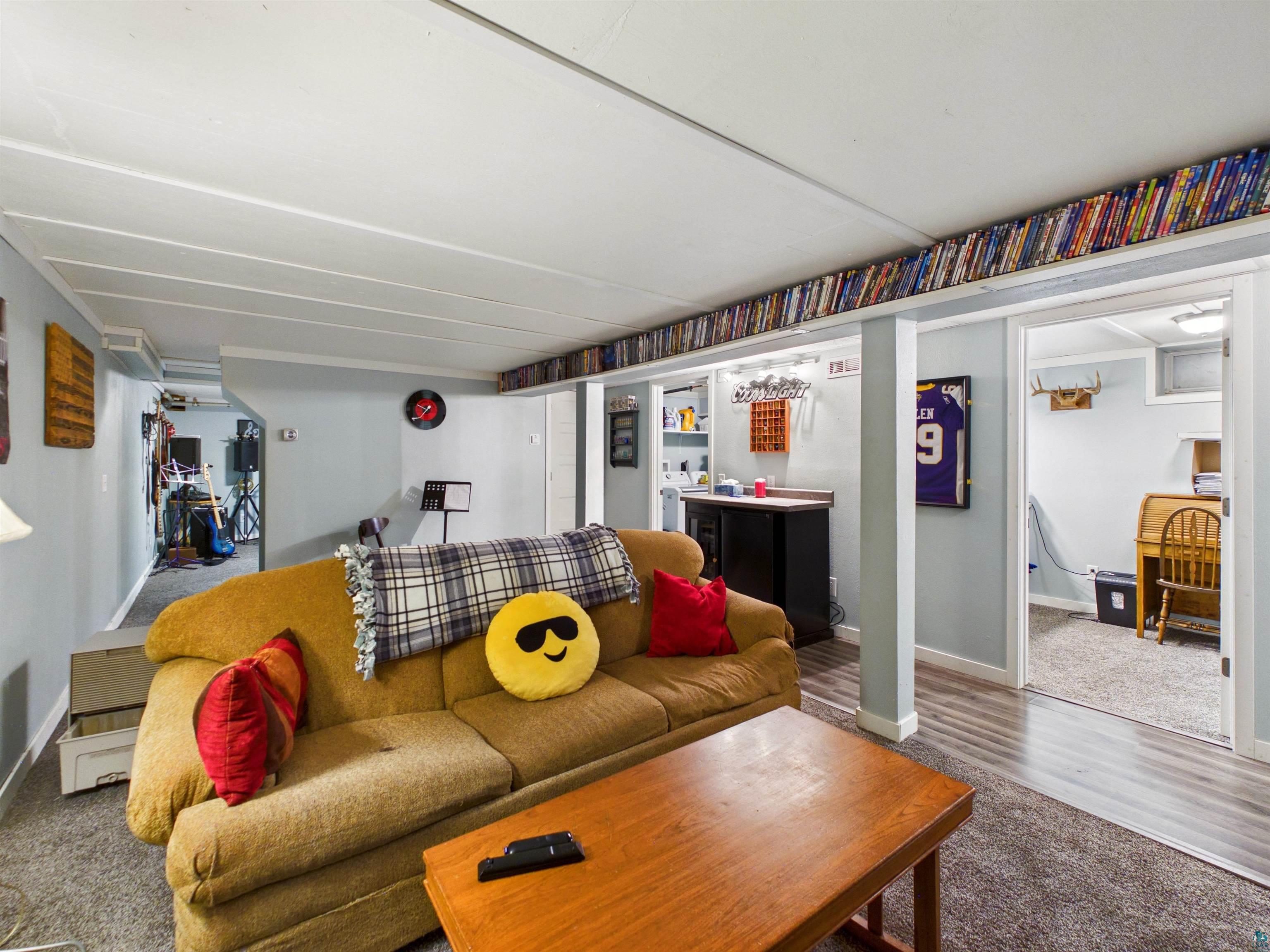 10719 North Oak Ridge Street Hayward, WI 54843 - Photo 41 of 57 Living area featuring baseboards and wood finished floors