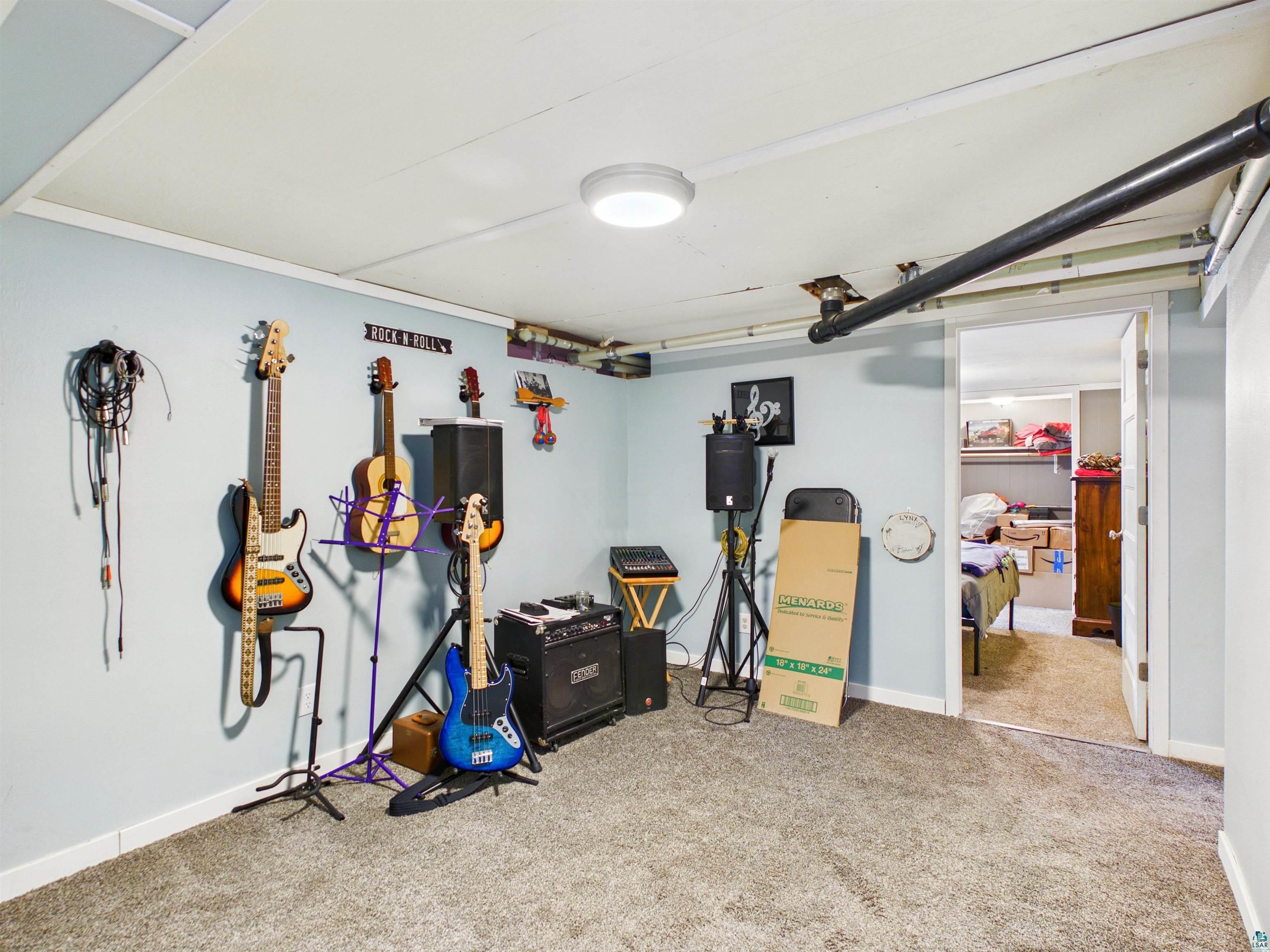 10719 North Oak Ridge Street Hayward, WI 54843 - Photo 48 of 57 Finished below grade area featuring carpet floors and baseboards