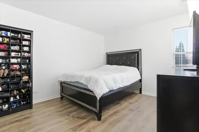 a bedroom with a bed and window