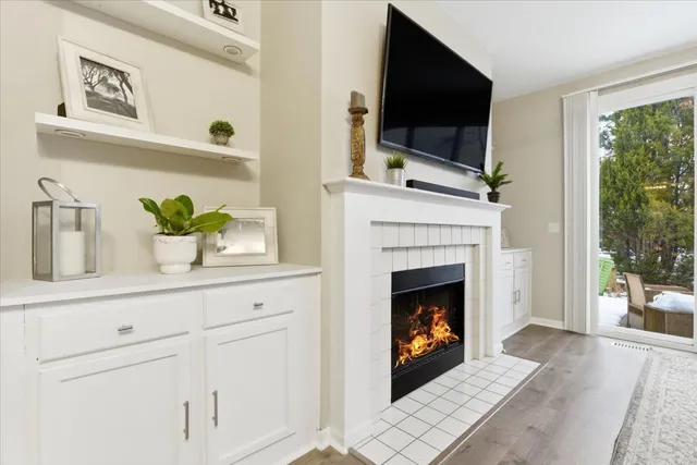 a living room with furniture fireplace and flat screen tv