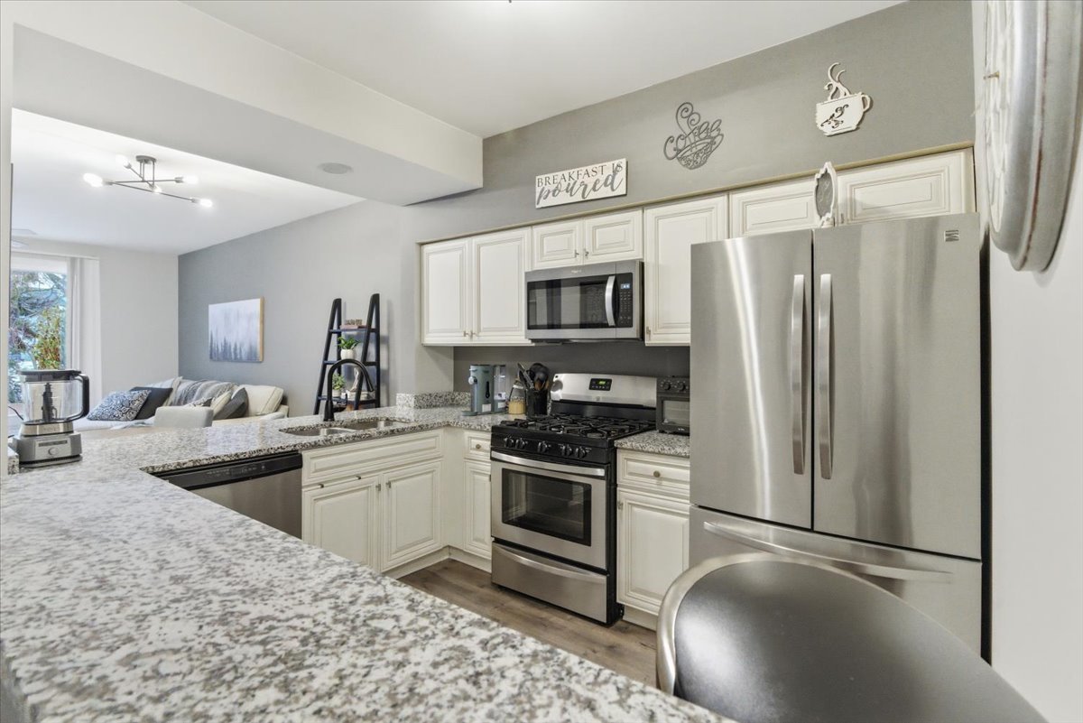 1389 South Candlestick Way Waukegan, IL 60085 - Photo 8 of 12 a kitchen with a refrigerator stove and sink