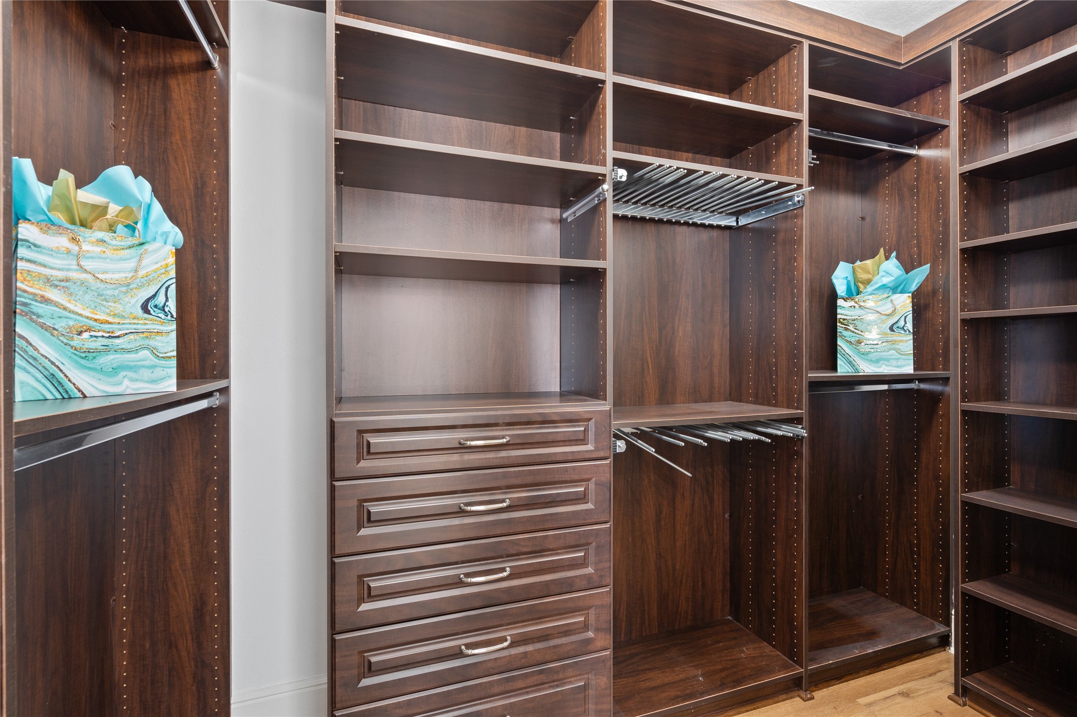 407 Isles End Road Tiki Island, TX 77554 - Photo 25 of 34 a view of walk in closet with clothes