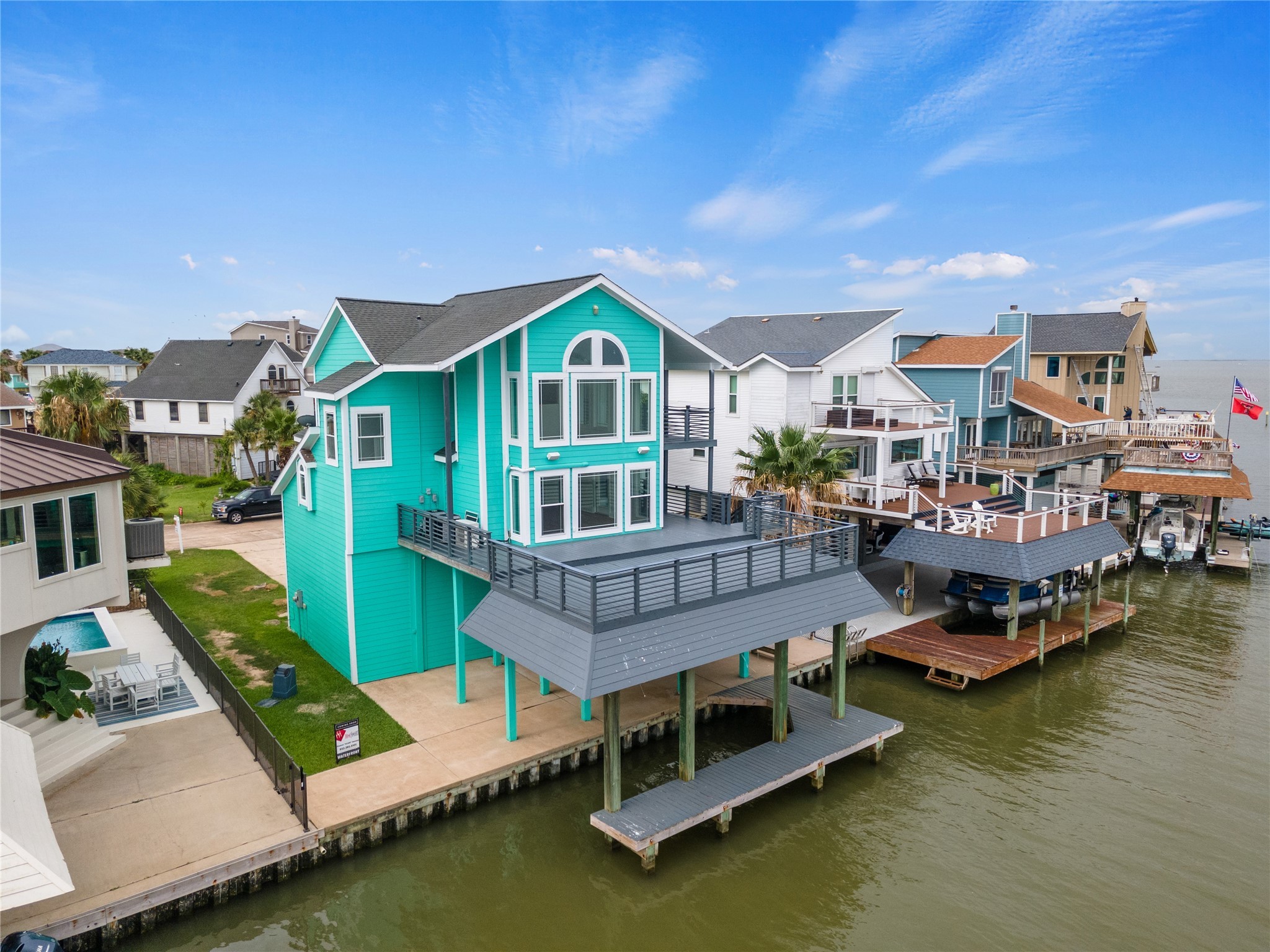 407 Isles End Road Tiki Island, TX 77554 - Photo 3 of 34 a view of a house with pool