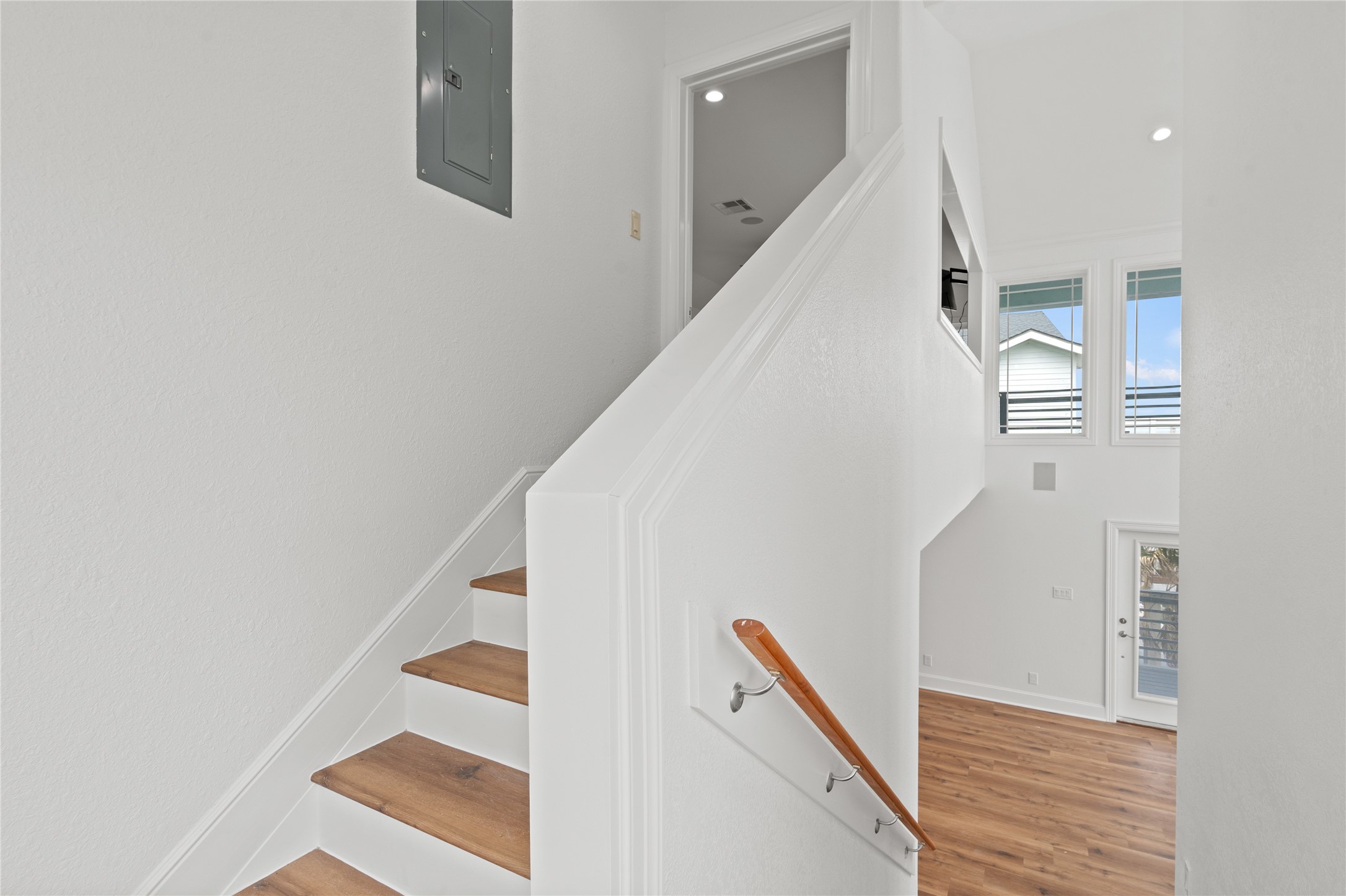 407 Isles End Road Tiki Island, TX 77554 - Photo 32 of 34 a view of staircase with white walls and windows