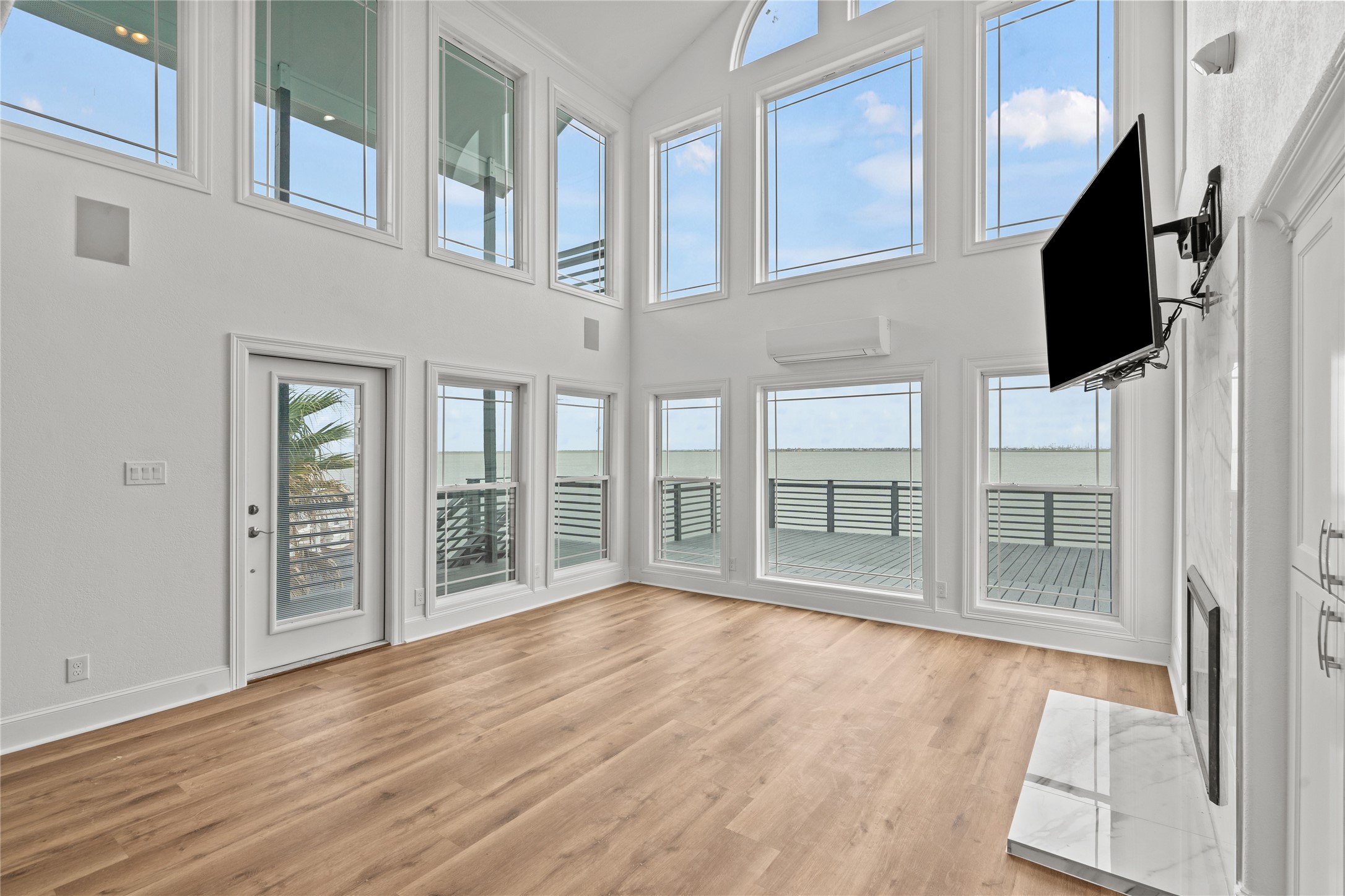 407 Isles End Road Tiki Island, TX 77554 - Photo 6 of 34 a view of an entryway with wooden floor