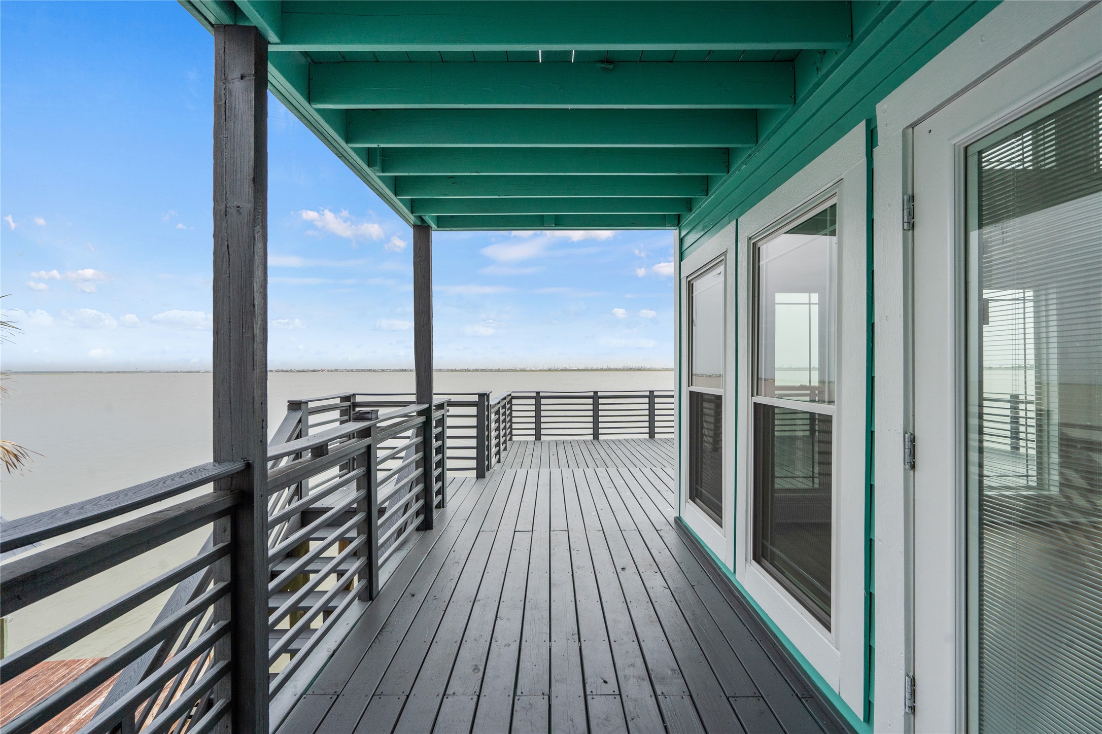 407 Isles End Road Tiki Island, TX 77554 - Photo 7 of 34 a view of balcony with wooden floor