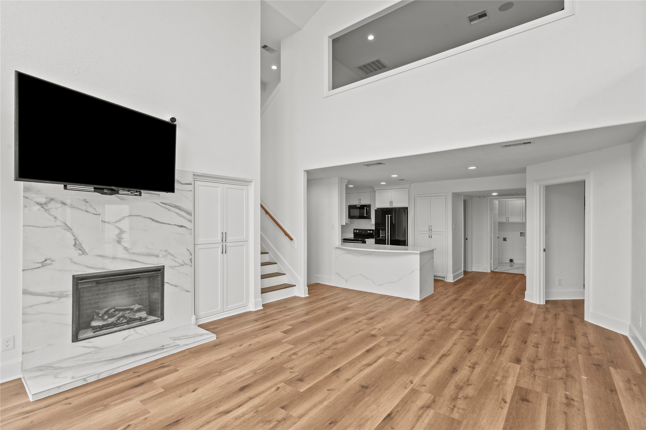 407 Isles End Road Tiki Island, TX 77554 - Photo 9 of 34 a bedroom with a bed and a flat screen tv