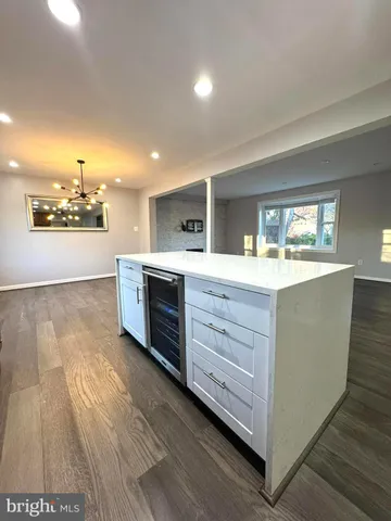 a view of a kitchen cabinets and wooden floor