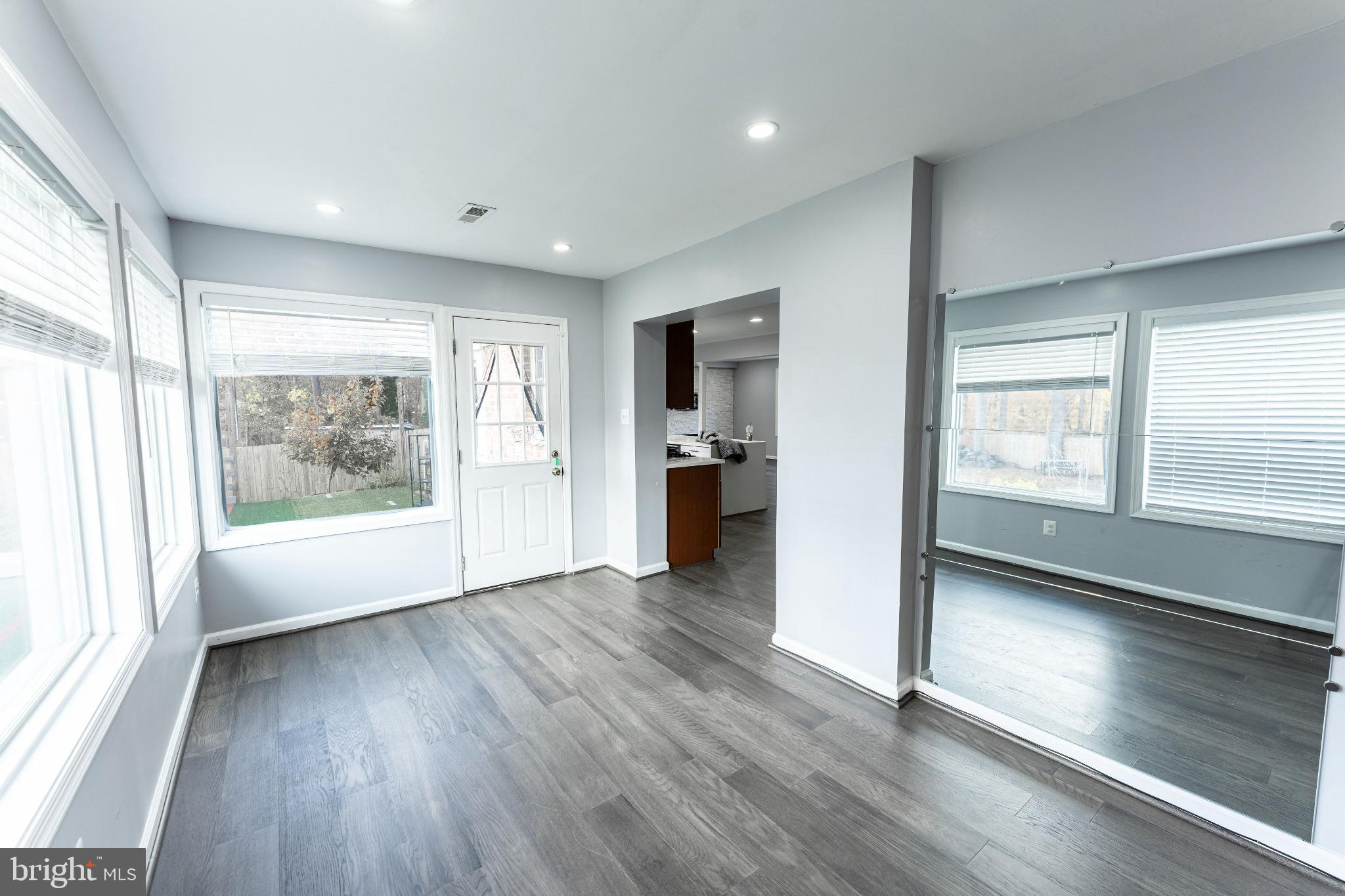 6910 Ontario Street Springfield, VA 22152 - Photo 12 of 44 a view of an empty room with window and wooden floor