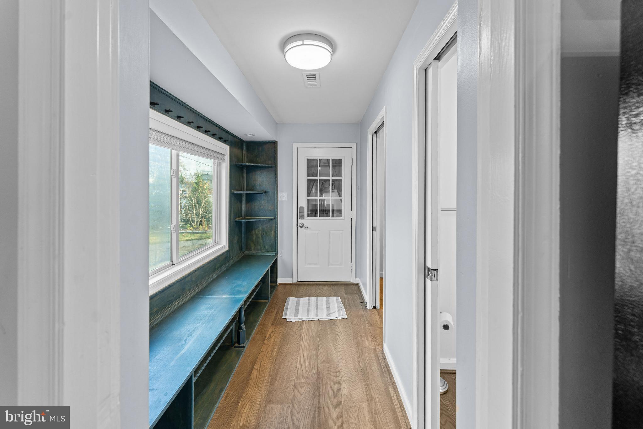 6910 Ontario Street Springfield, VA 22152 - Photo 14 of 44 a view of a hallway with wooden floor and staircase