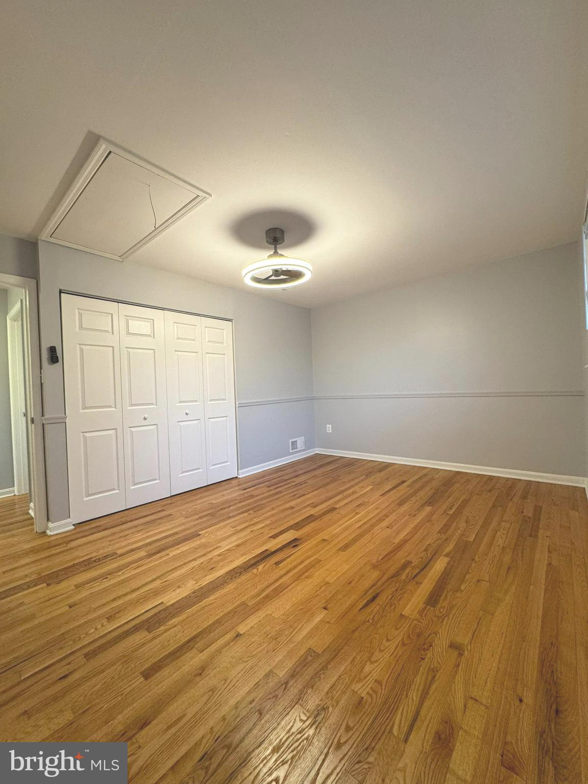 6910 Ontario Street Springfield, VA 22152 - Photo 20 of 44 an empty room with wooden floor and windows