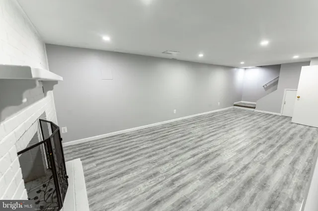 a view of hallway with wooden floor