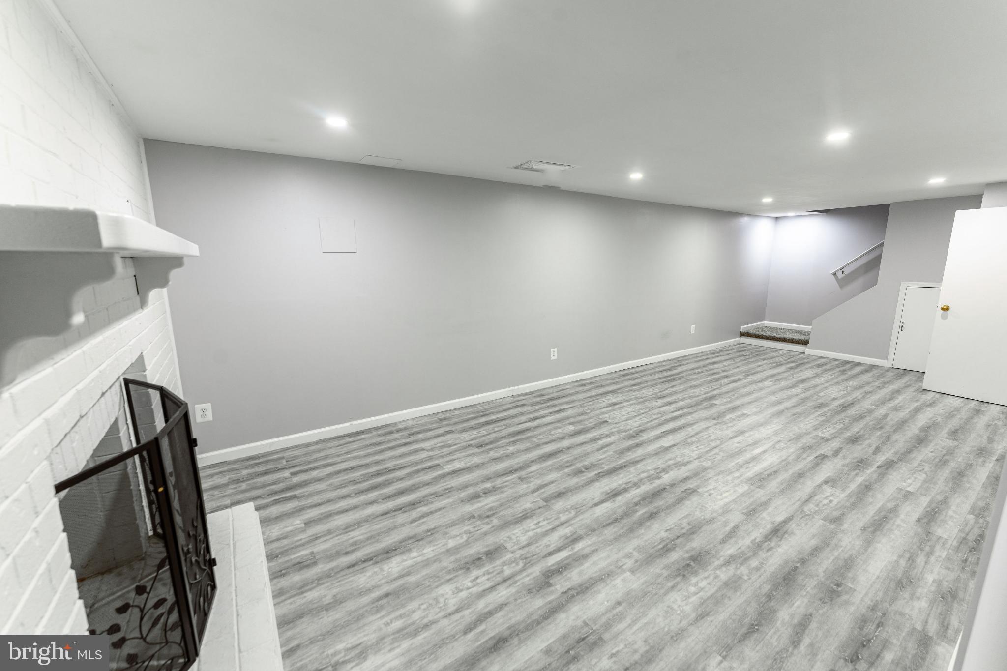 6910 Ontario Street Springfield, VA 22152 - Photo 26 of 44 a view of hallway with wooden floor
