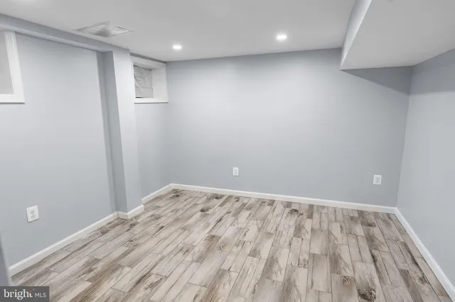 a view of room with wooden floor