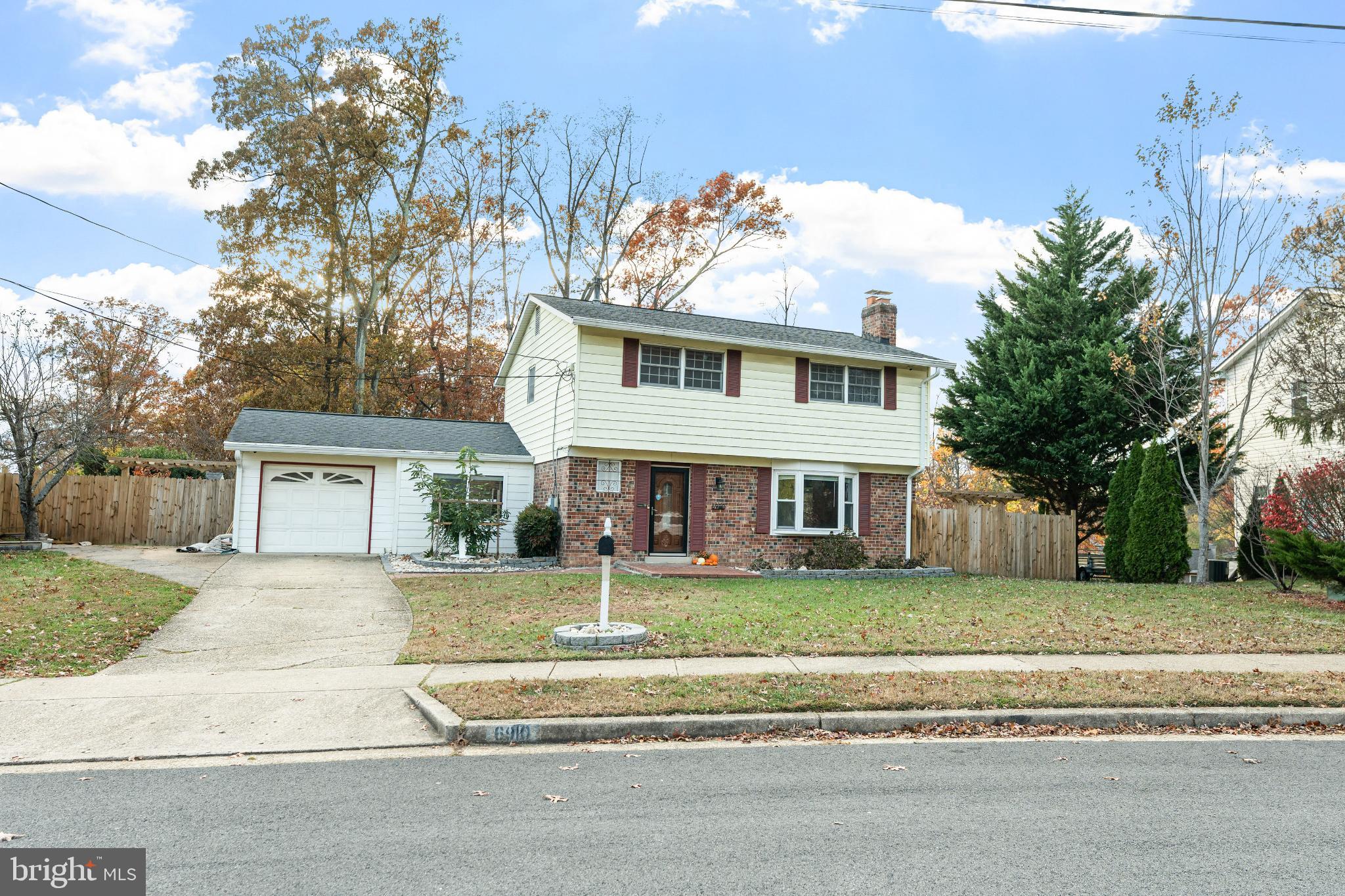 6910 Ontario Street Springfield, VA 22152 - Photo 34 of 44 front view of a house with a small yard