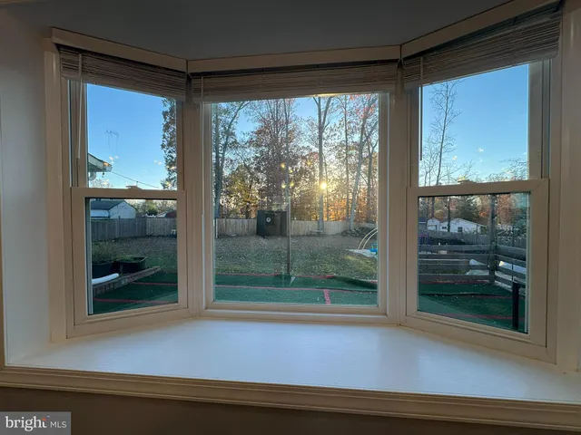 a view of a glass door and a window