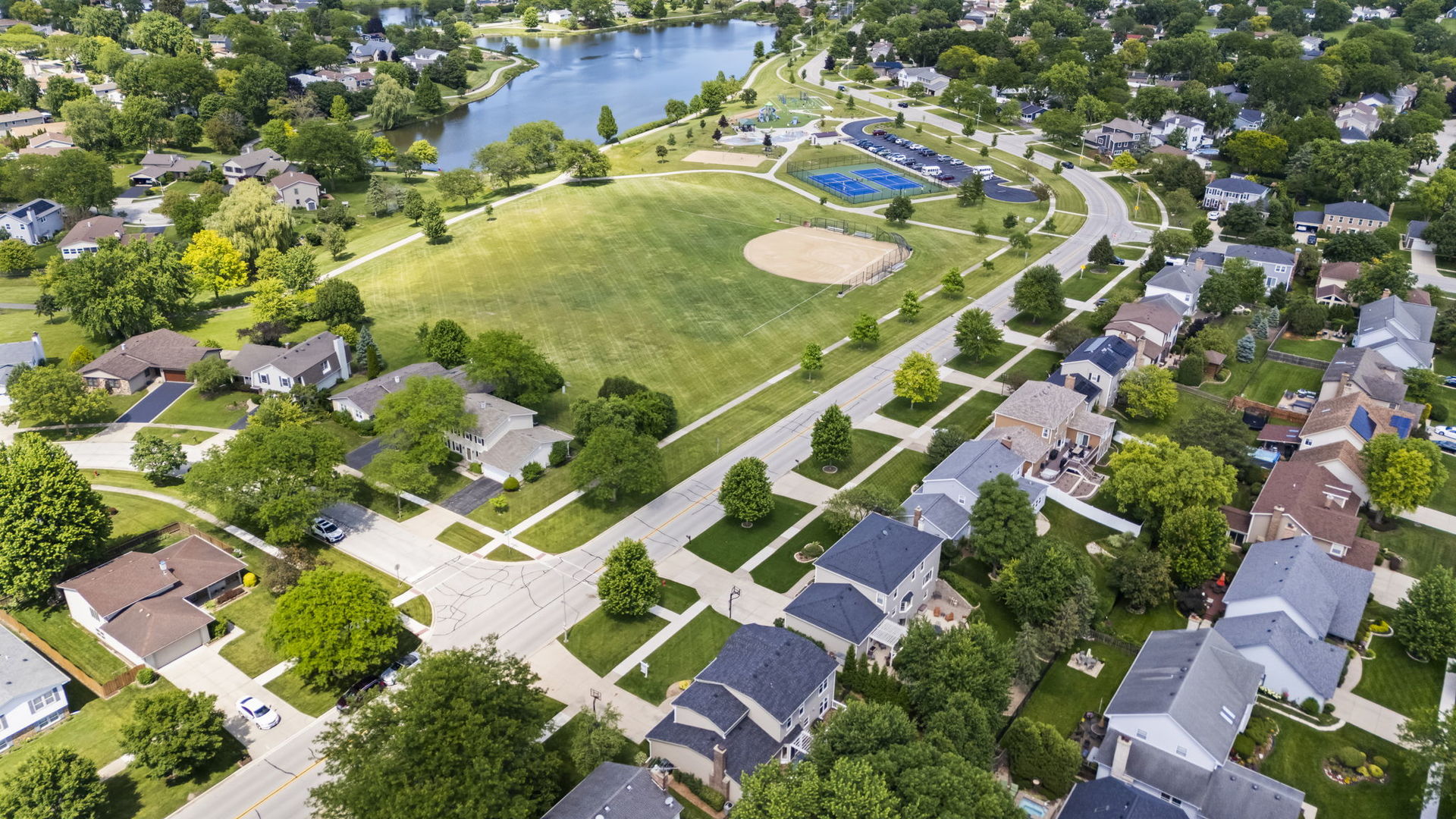 1565 Freeman Road Hoffman Estates, IL 60192 - Photo 41 of 46 an aerial view of a house with a yard and swimming pool