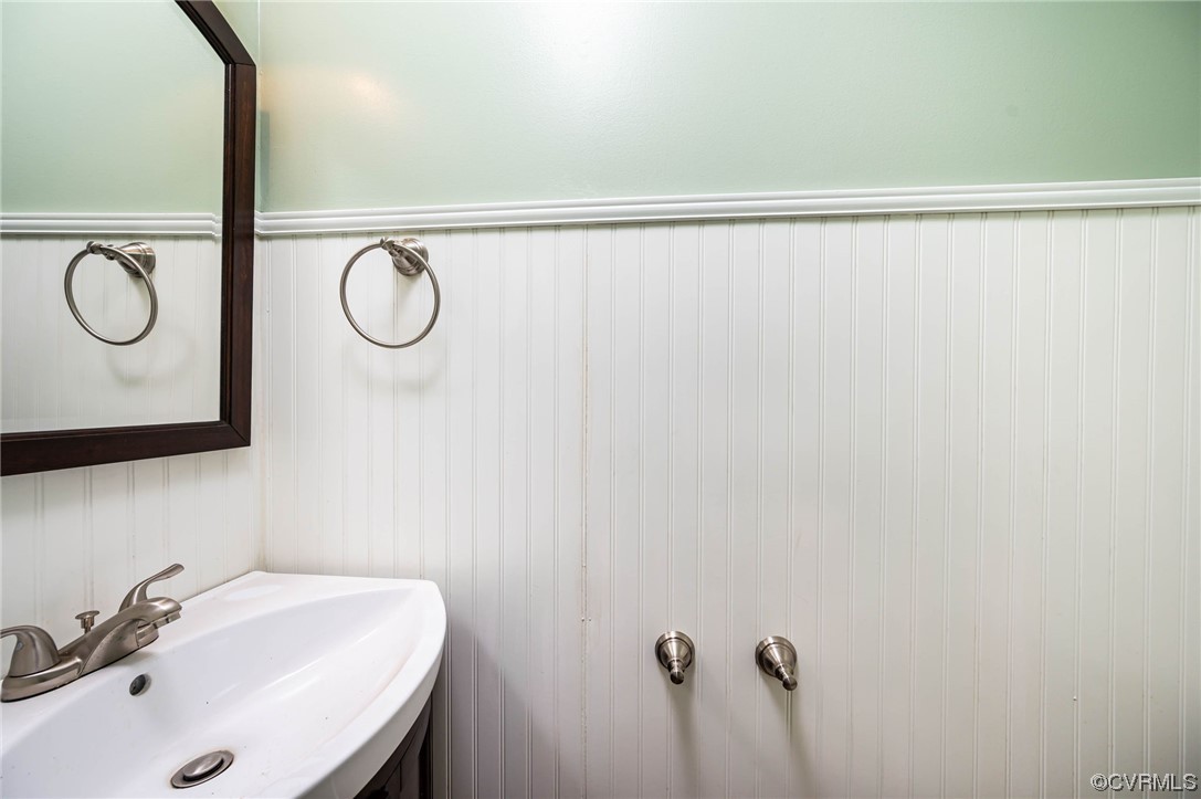 16001 Meridian Avenue Chester, VA 23831 - Photo 13 of 26 a bathroom with a sink and a mirror