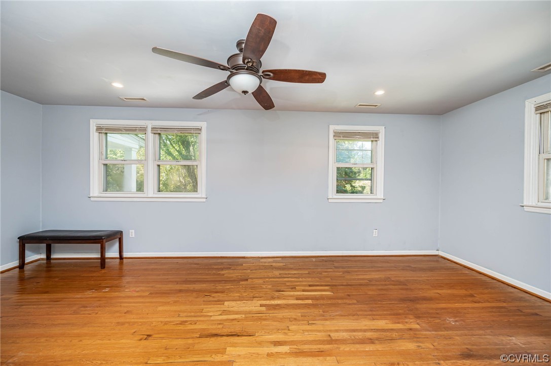 16001 Meridian Avenue Chester, VA 23831 - Photo 15 of 26 a view of a room with wooden floor and a ceiling fan