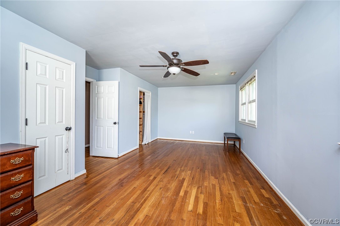 16001 Meridian Avenue Chester, VA 23831 - Photo 17 of 26 wooden floor in an empty room with a window